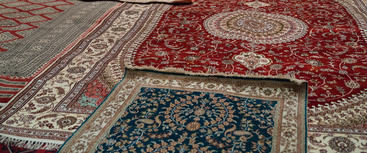 Does Premier Rug Cleaning offer any additional services, such as stain removal or rug repairs?