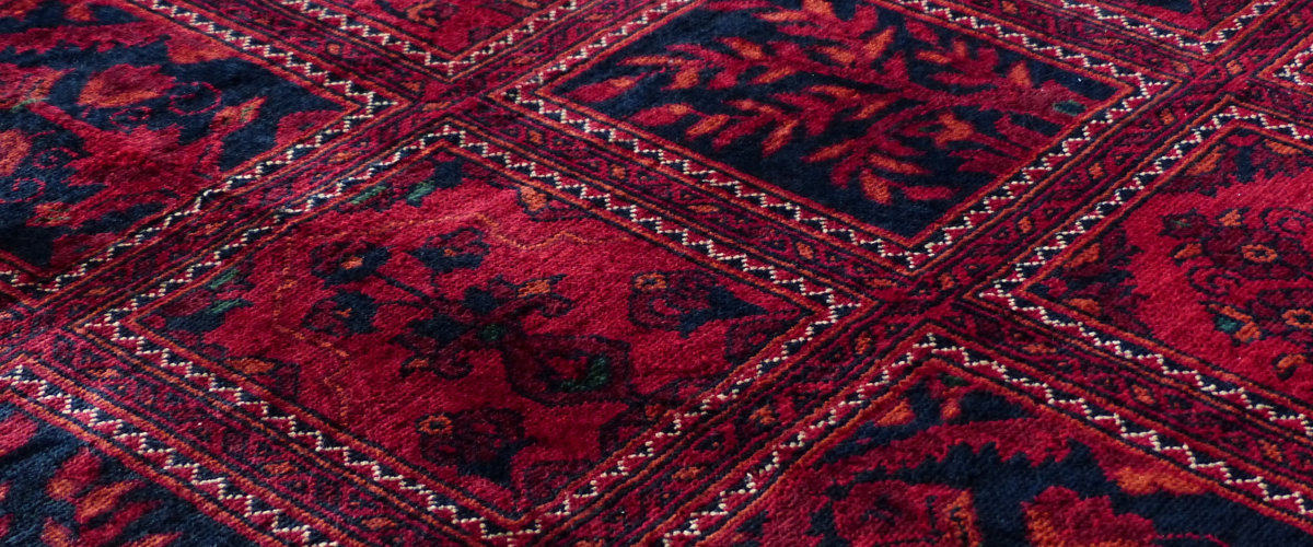 How often should carpets be professionally cleaned?